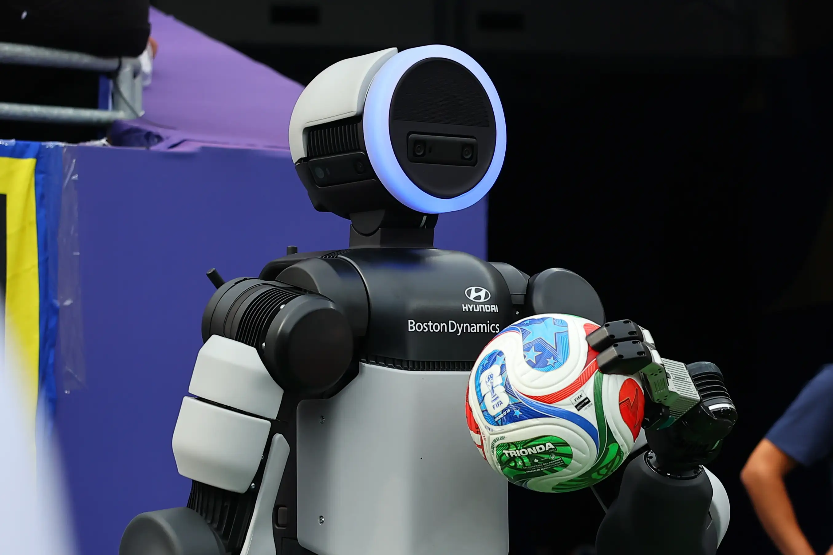A Boston Dynamics robot on the pitch during the World Cup match between Brazil and Norway.