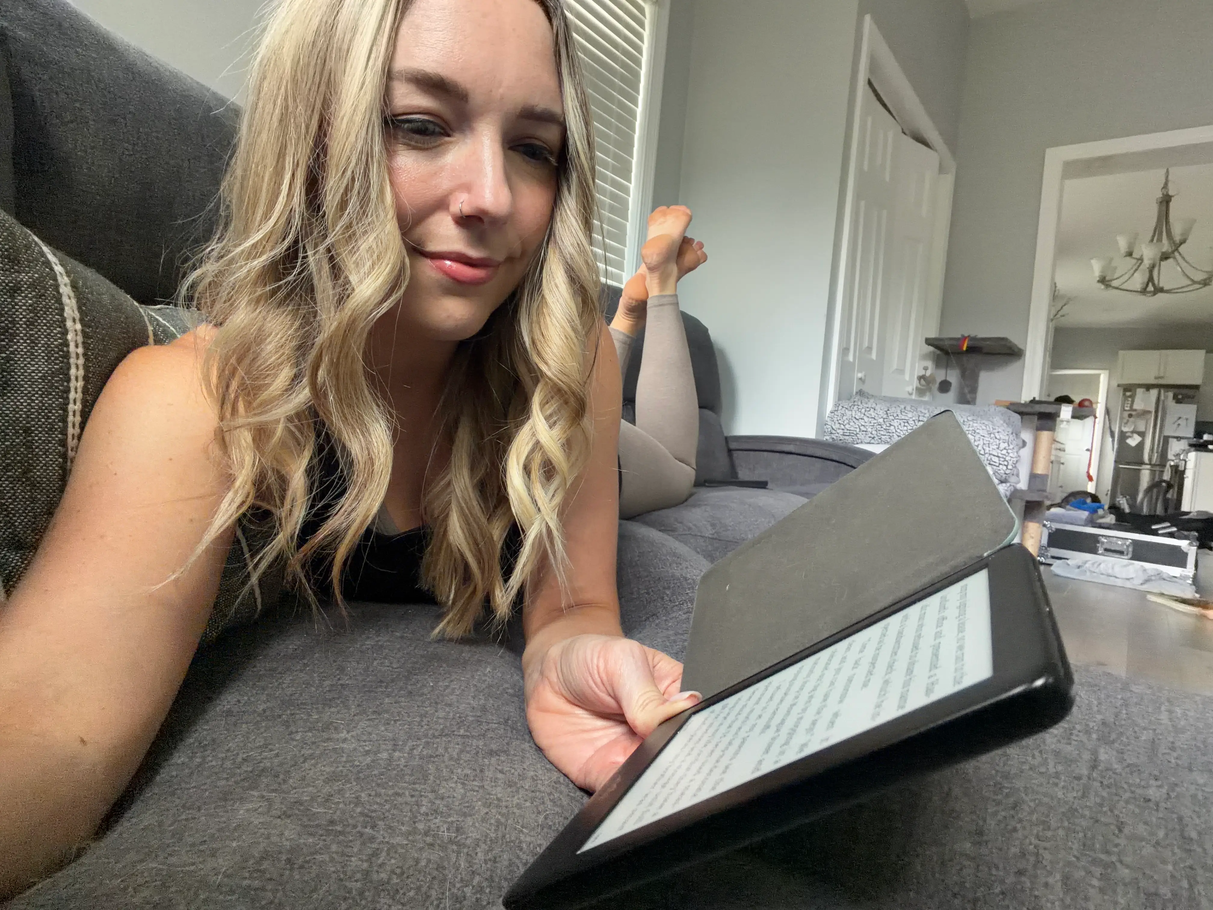 Rebecca reading on an e-reader.