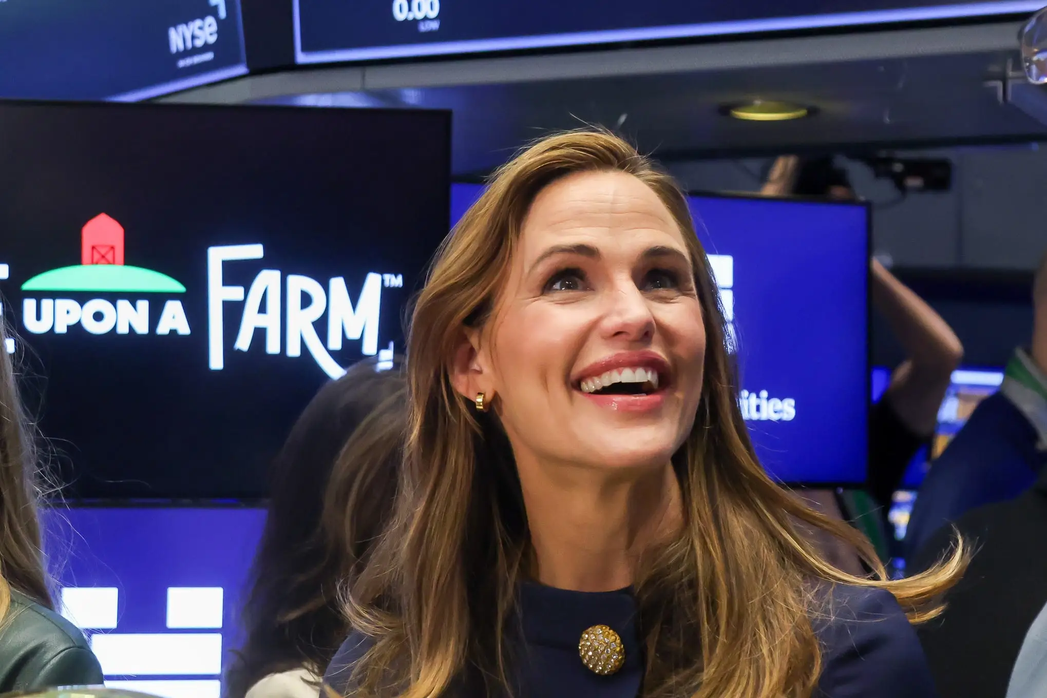 Cassandra Curtis, co-founder of Once Upon a Farm, from center left, Jennifer Garner, co-founder of Once Upon a Farm, and John Foraker, co-founder and chief executive officer of Once Upon a Farm, during the company's initial public offering (IPO) on the floor of the New York Stock Exchange (NYSE) in New York, US, on Friday, Feb. 6, 2026. Once Upon a Farm PBC, the organic kids snacks maker co-founded by actress Jennifer Garner, jumped 17% in its trading debut Friday, after the company and some of its investors raised $197.9 million in an initial public offering.