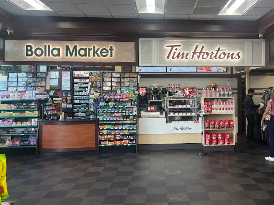 A Tim Horton's kiosk next to a Bolla Market kiosk.
