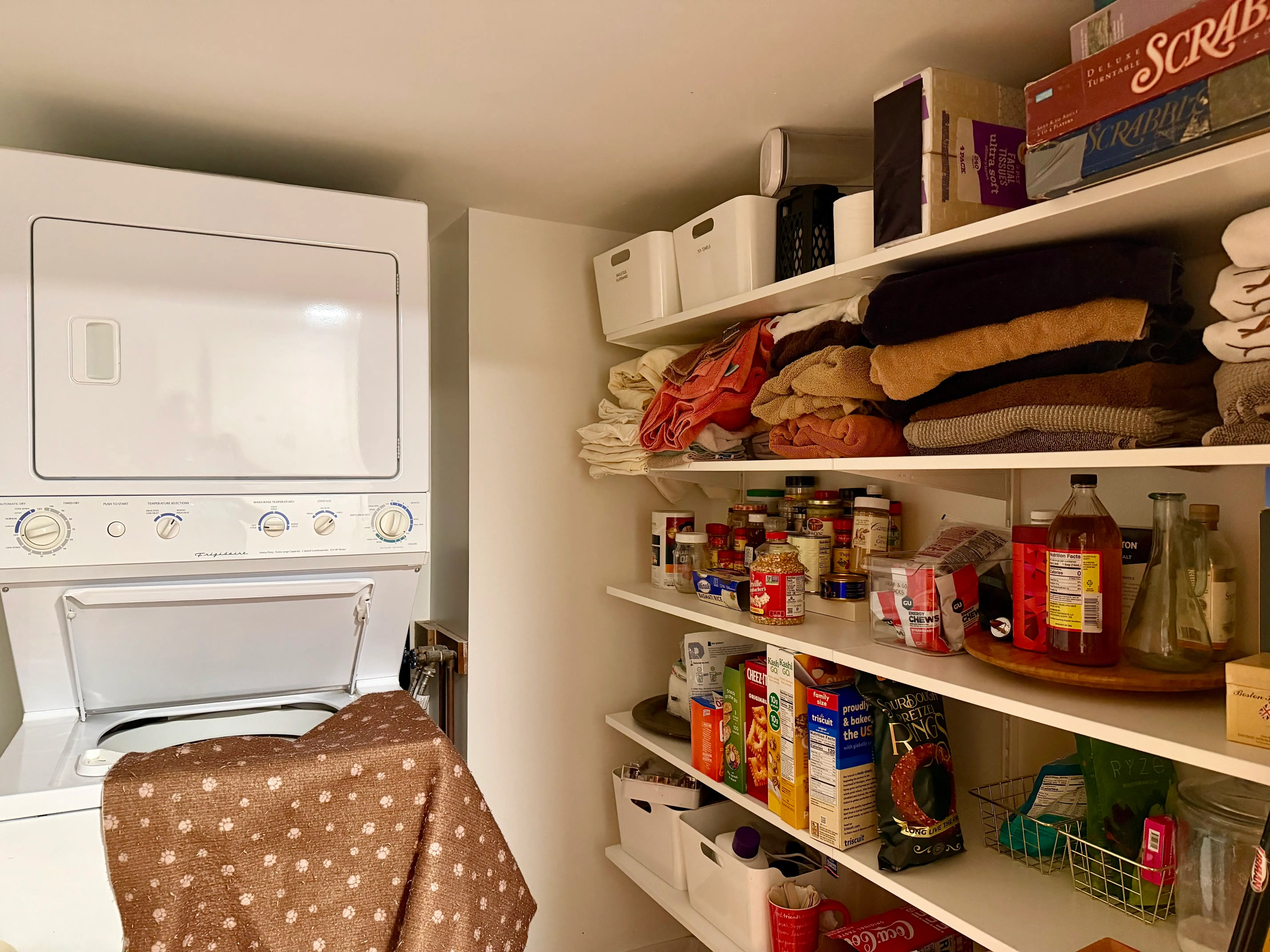 The laundry room has a pantry and linens.