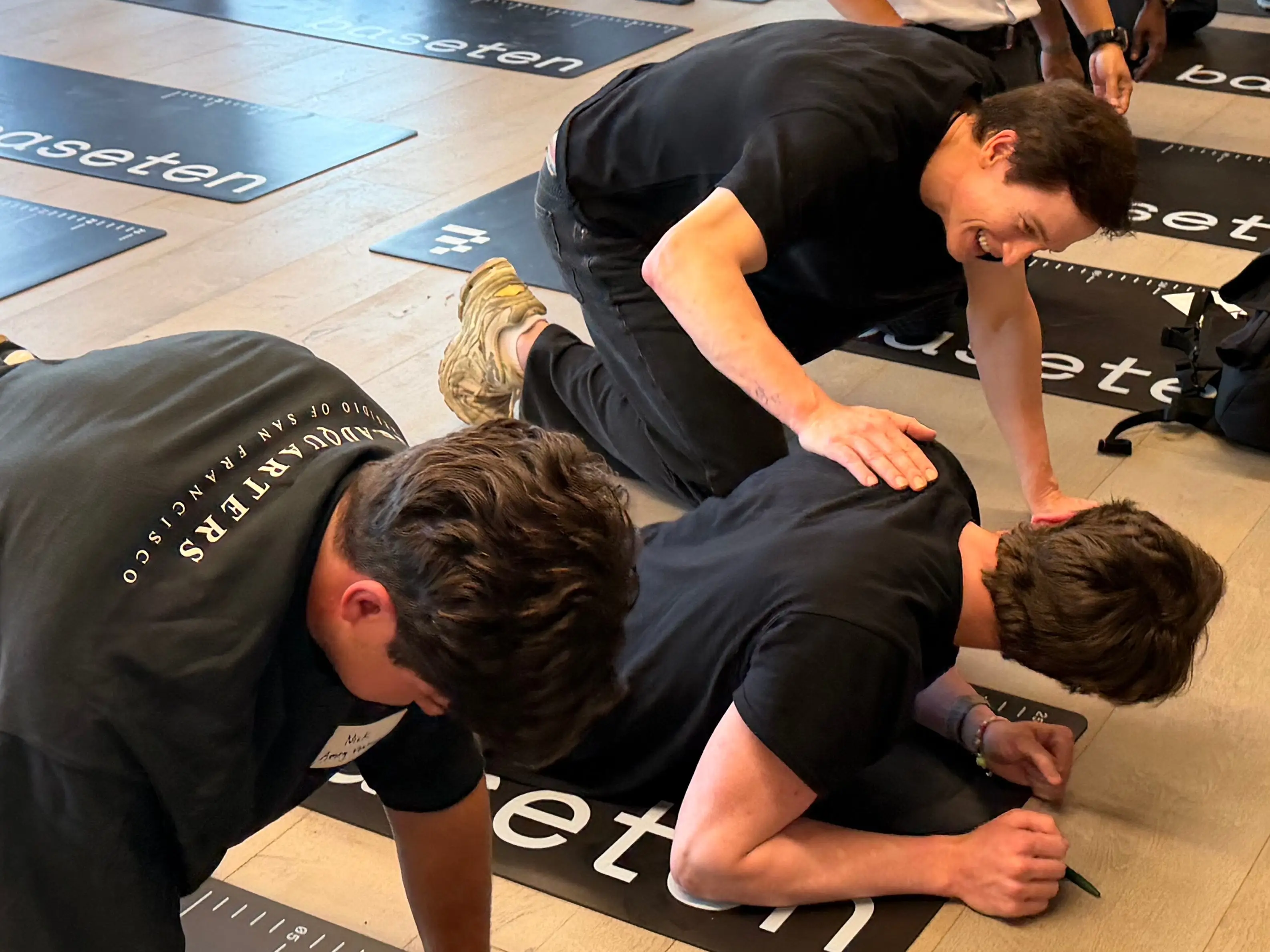 Bryan Johnson cheers on participants trying to do as many push-ups as possible during a longevity test.