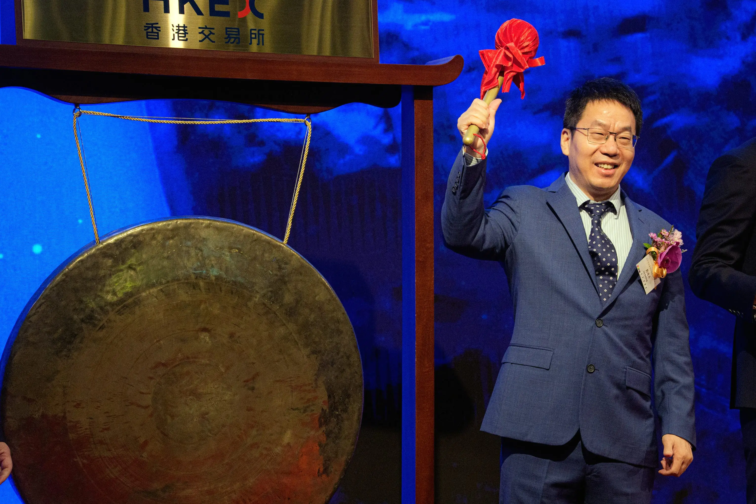 Liu Debing, chairman of Knowledge Atlas Technology JSC Ltd., better known as Zhipu, left, during the company's listing ceremony at the Hong Kong Stock Exchange in Hong Kong, China.