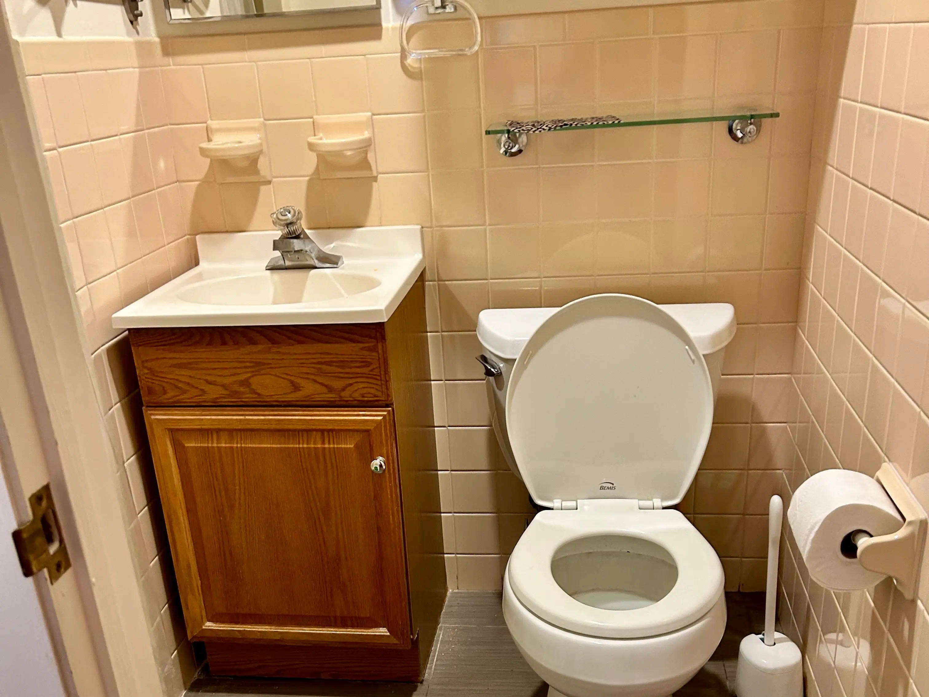 Before the renovation, the shower was barely big enough to stand in, and the tiling and flooring needed work.