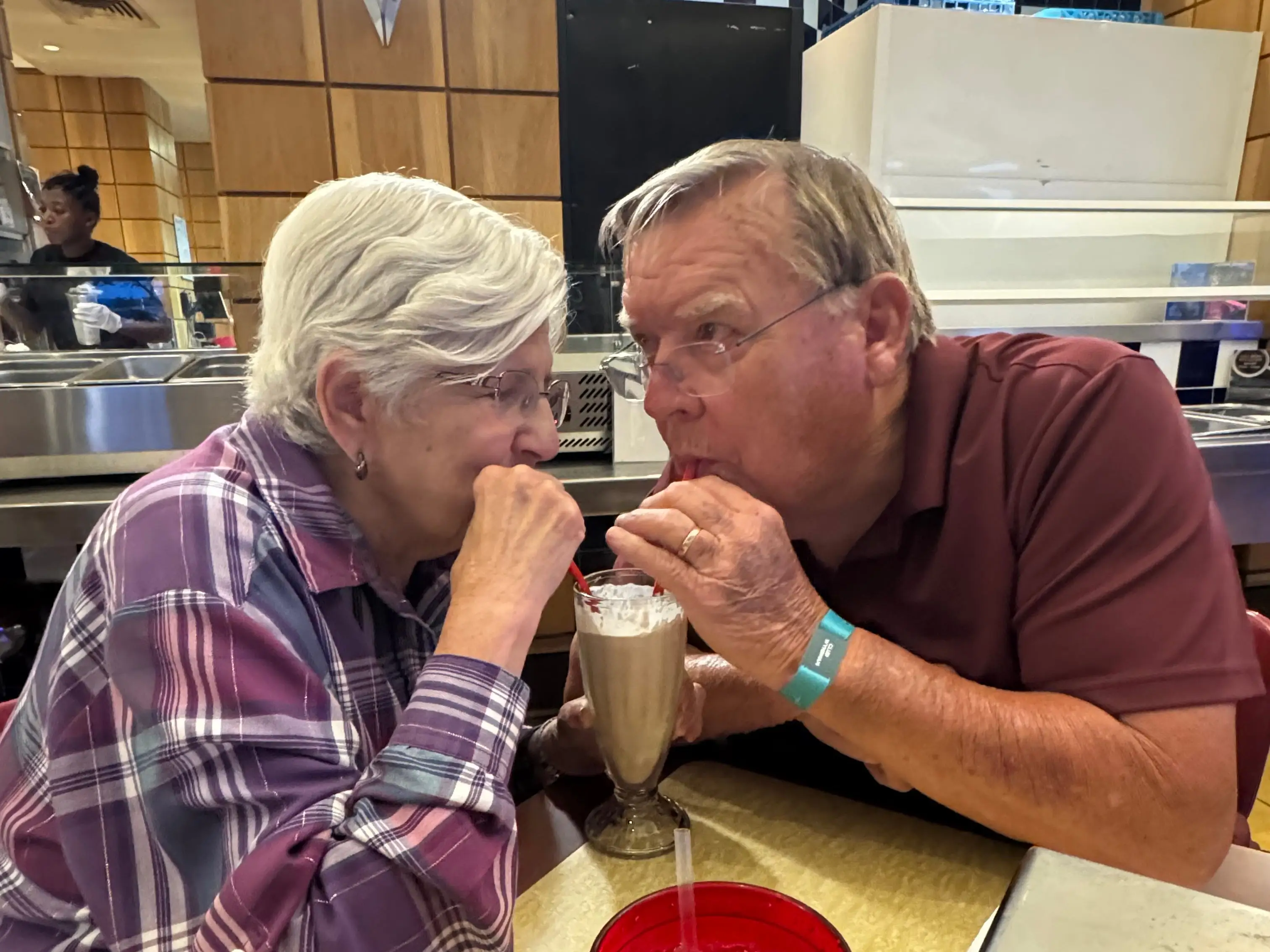 the author's parents sharing a milkshake