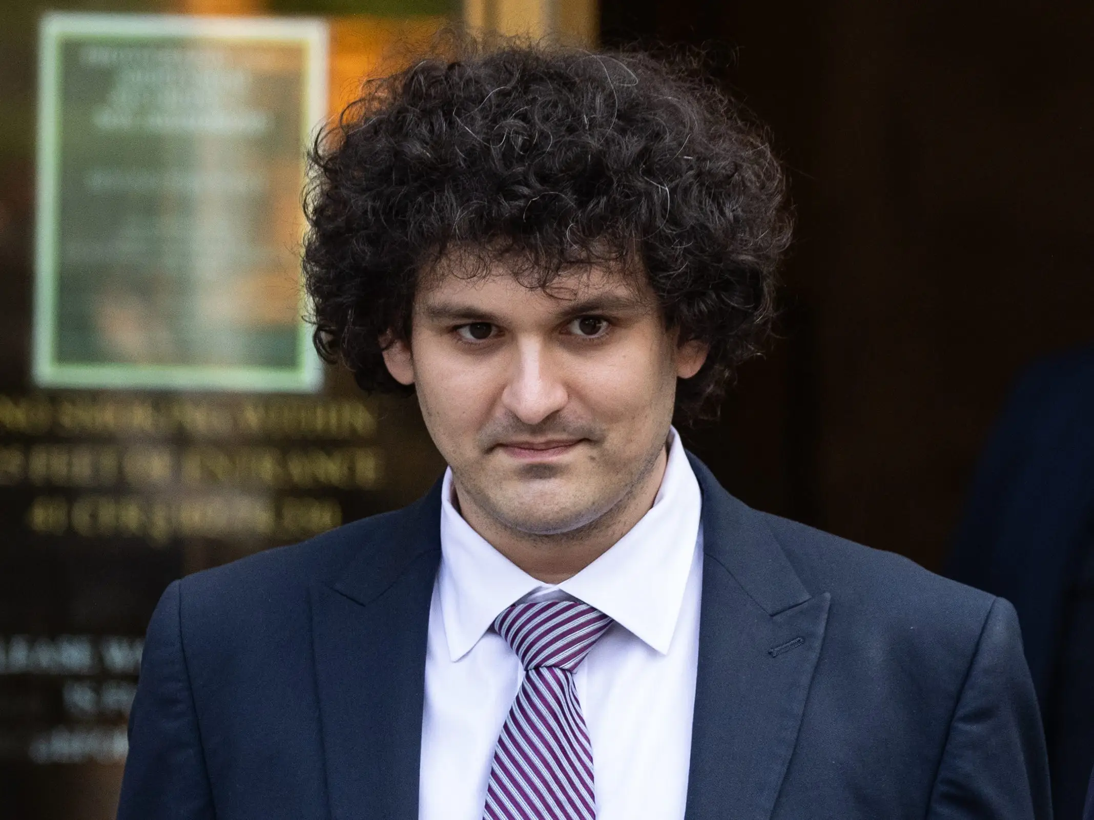 Sam Bankman Fried leaving court