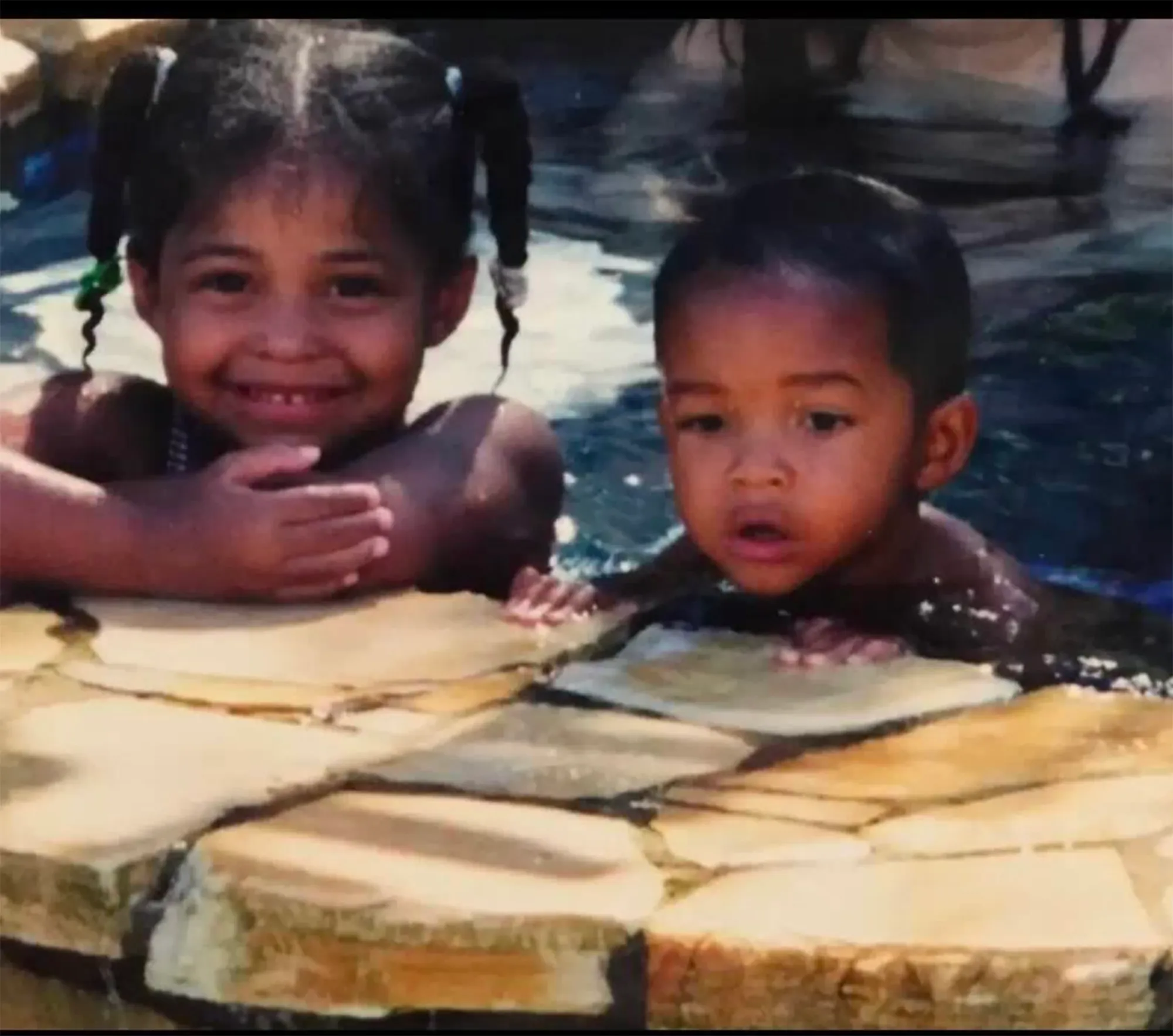 Jordyn Woods and Jaden Smith as young children in a pool.