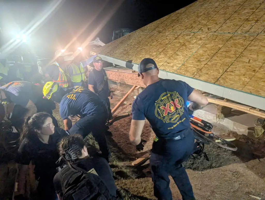 Firefighters work the scene at the house collapse that killed a construction worker on Aug. 27, 2026.