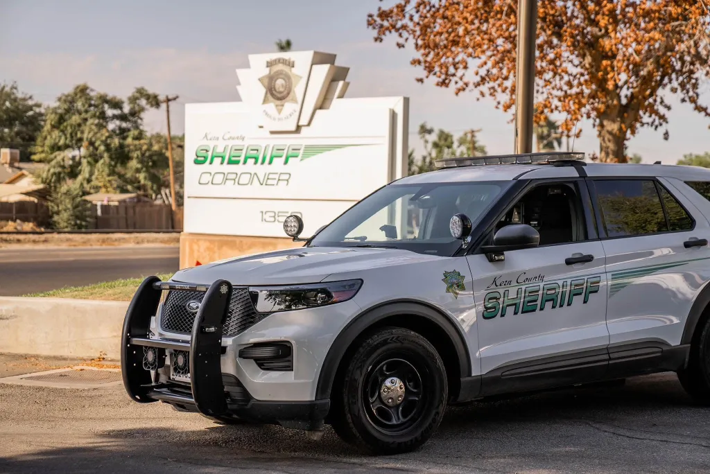 A Kern County Sheriff's Office vehicle parked in front of the Sheriff Coroner building.