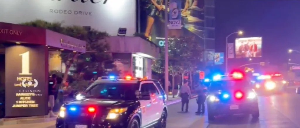 Police vehicles with flashing lights outside the 1 Hotel on Sunset Boulevard after a shooting.