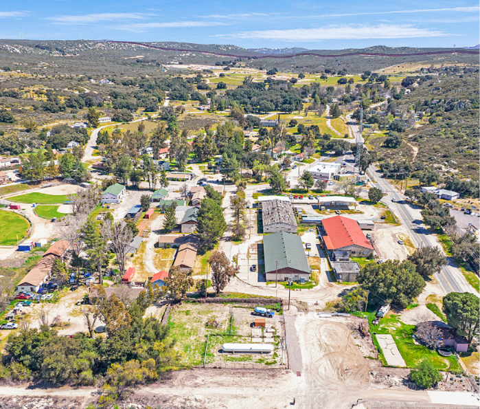 Aerial view of Campo, California, showing 28 buildings across the town and undeveloped land.