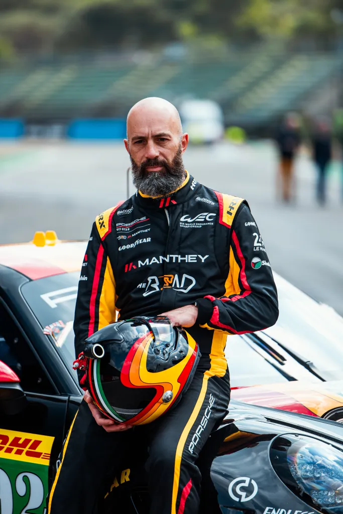 Yasser Shahin of The Bend Manthey poses for a portrait with his race helmet.