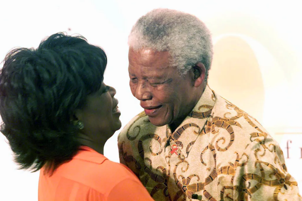 Oprah Winfrey embraces former South African President Nelson Mandela during the ground breaking ceremony for the girls school on Dec. 6, 2002.