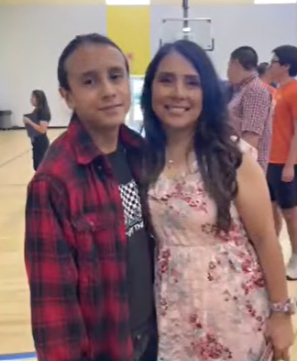 Maliki Perales, 11, with a woman.