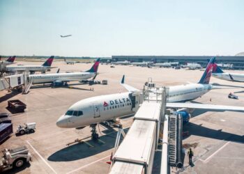Passengers evacuate down  slide at ATL airport shortly after smoke forces emergency landing