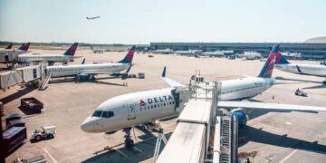 Passengers evacuate down  slide at ATL airport shortly after smoke forces emergency landing