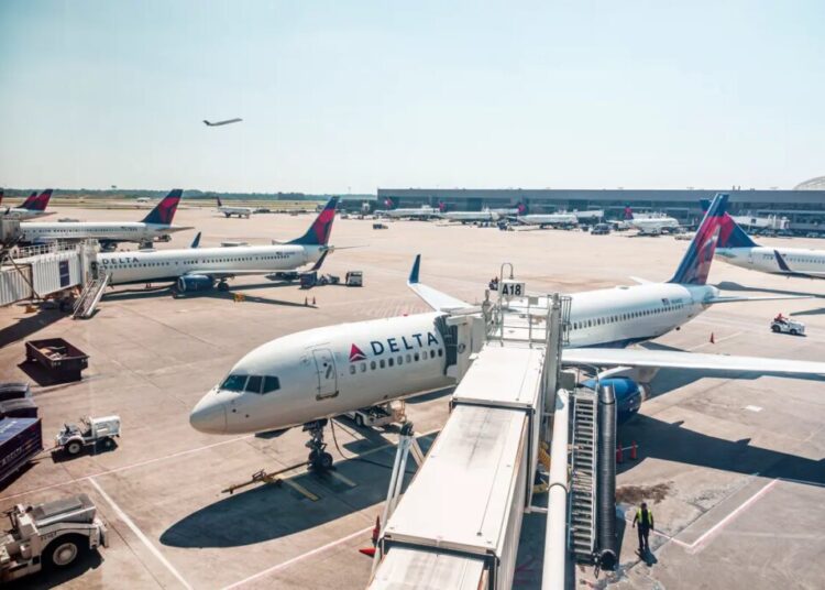 Passengers evacuate down  slide at ATL airport shortly after smoke forces emergency landing