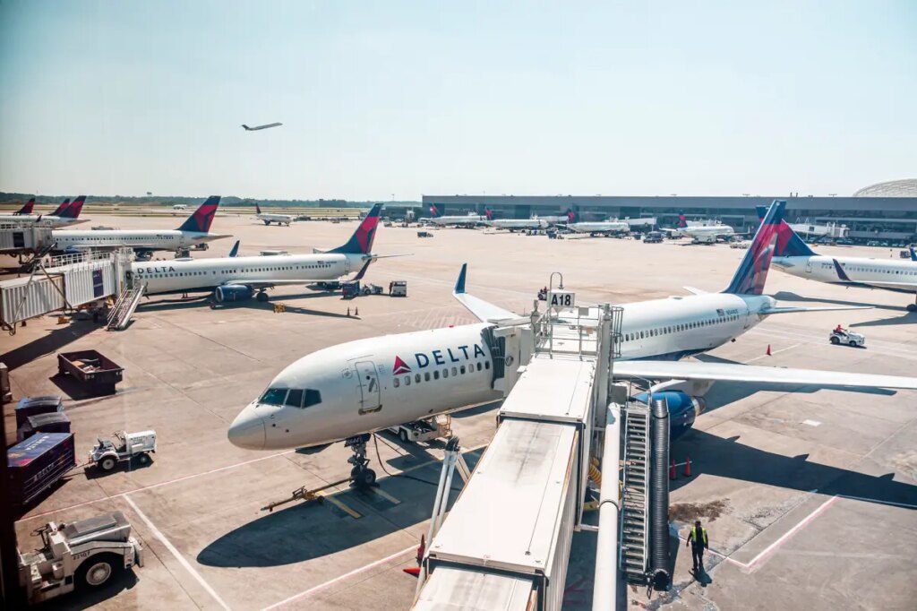 Passengers evacuate down  slide at ATL airport shortly after smoke forces emergency landing