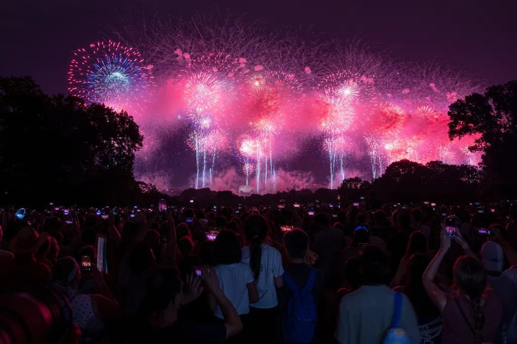 Crowd views fireworks over the Lincoln Memorial in Washington D.C.