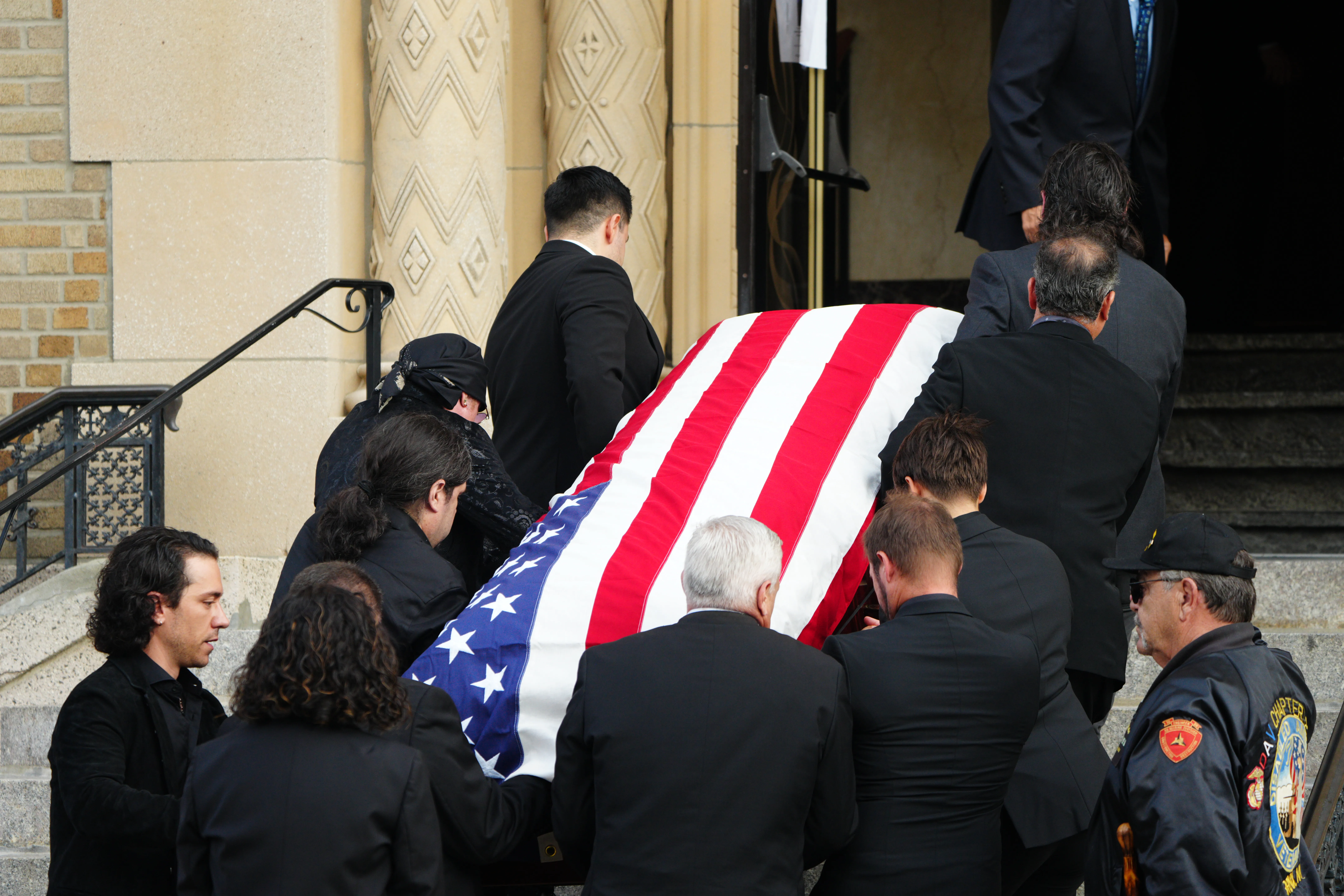 Actor and musician Stevie Van Zandt and other pallbearers carry the casket of actor Vincent Pastore 