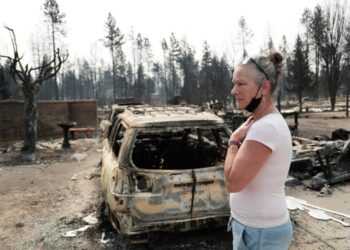 They fled by boat to the middle of Lake Spokane as wildfires closed in