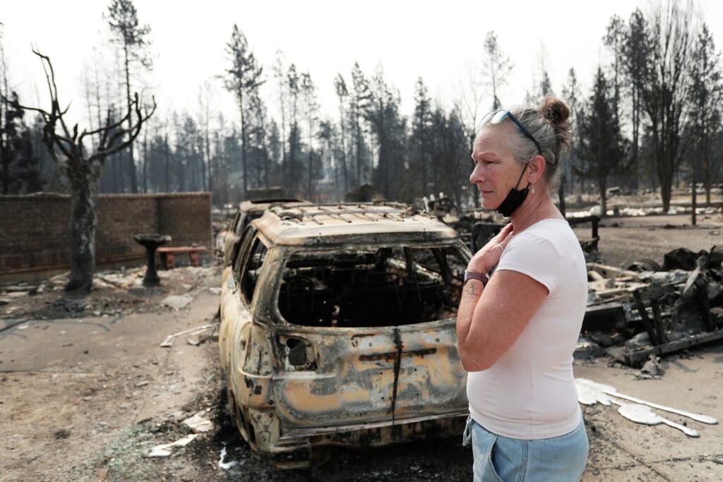 They fled by boat to the middle of Lake Spokane as wildfires closed in