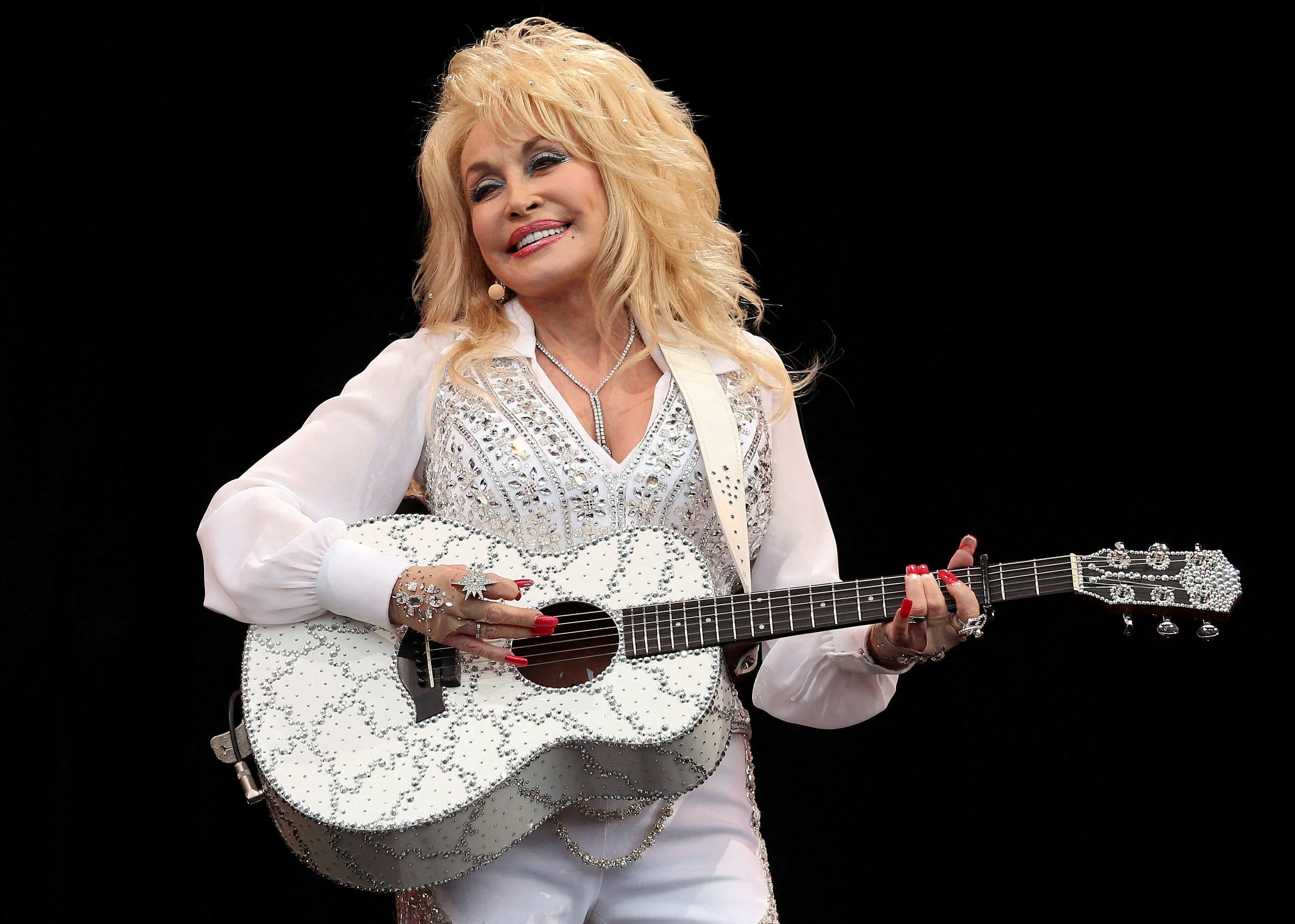 Parton performs on the Pyramid Stage at Worthy Farm in Somerset, during the Glastonbury Festival June 29, 2014.