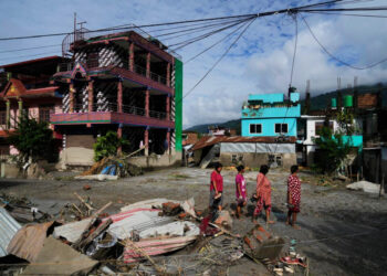 Rescuers race to find survivors after Himalayan floods kill more than 350