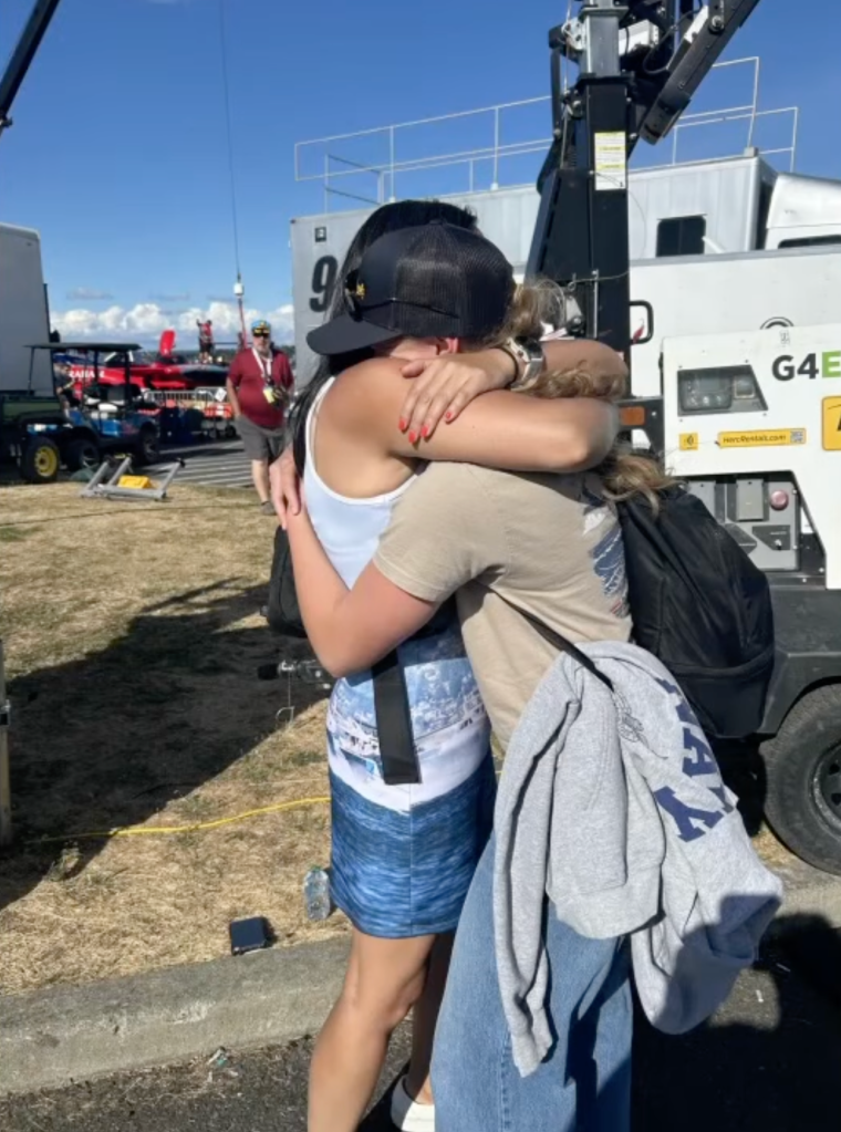 Vehling hugs Seafair President Emily Cantrell after rescuing the three girls from Lake Washington.