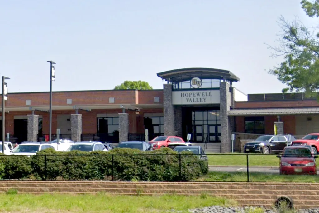 Hopewell Valley building with a parking lot in front.