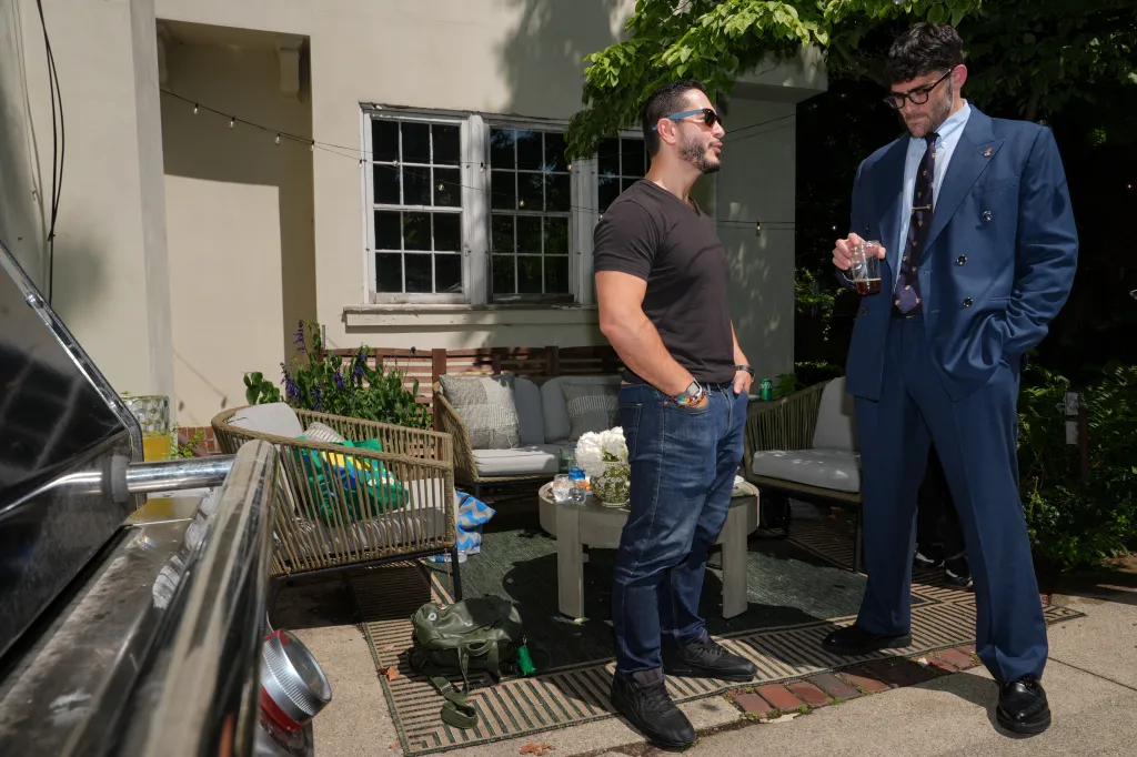 Democratic Senate candidate Abdul El-Sayed talks with far-left streamer Hasan Piker at a party in Detroit, Michigan, on Aug. 3, 2026.