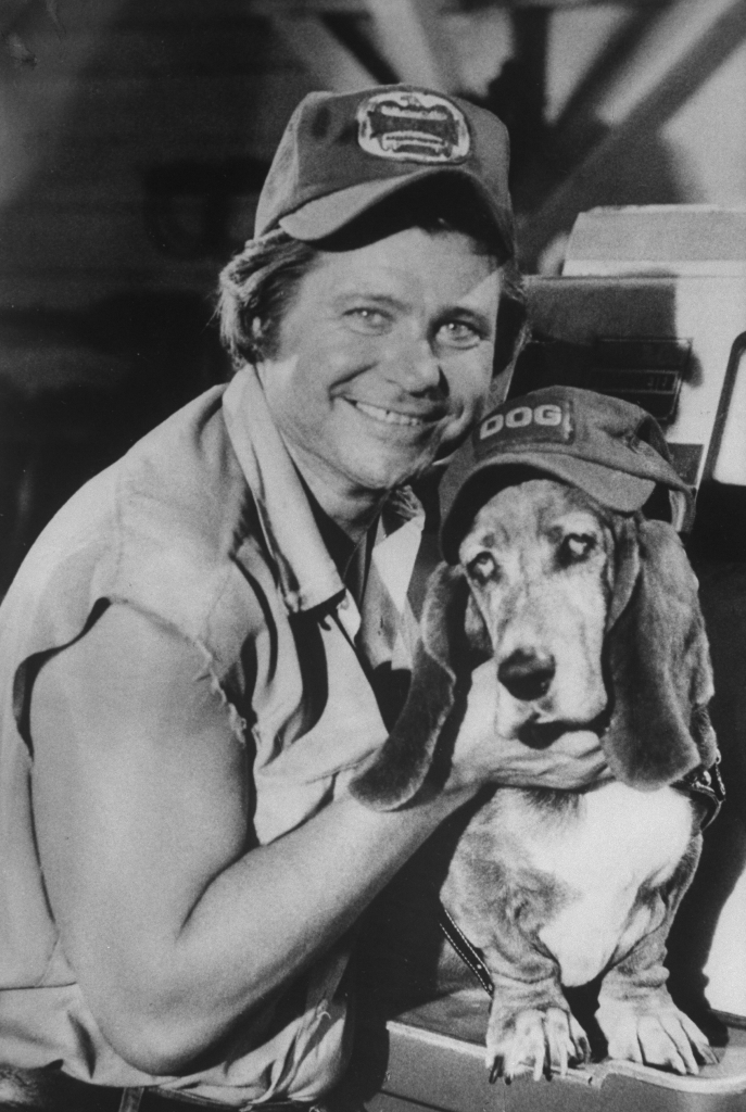 Ben Jones as Cooter from The Dukes of Hazzard with his dog, Flash.
