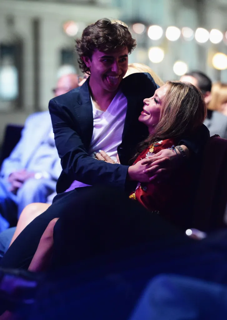 Jansen Panettiere with his mother, Lesley Vogel, smiling and embracing at the 23rd Annual Environmental Media Awards.