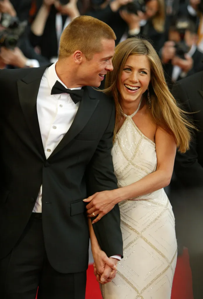 Brad Pitt and Jennifer Aniston holding hands at the 