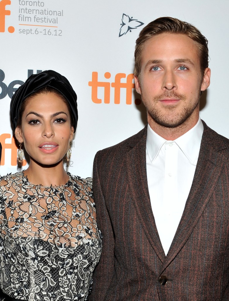 Actors Eva Mendes and Ryan Gosling pose at