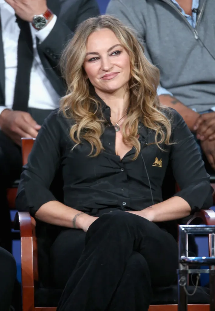 Actress Drea de Matteo smiling during a panel discussion.