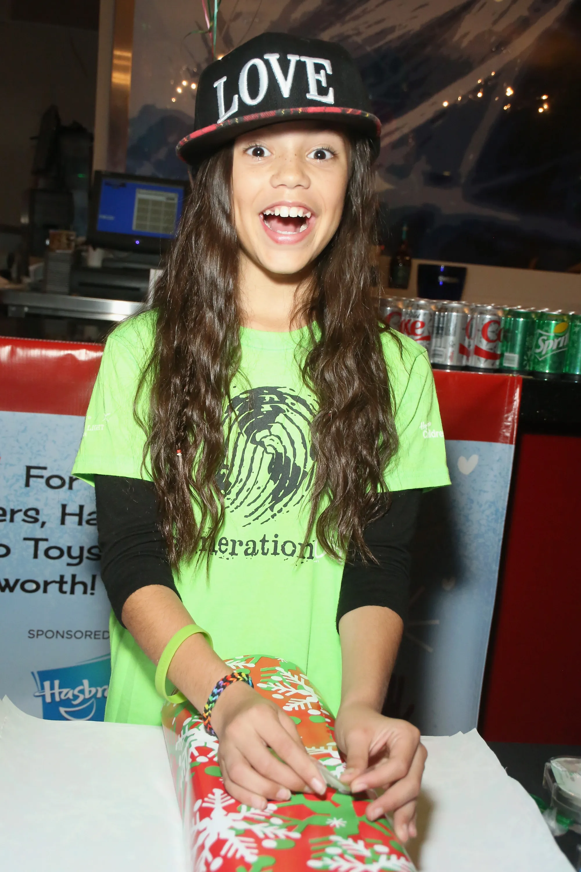Actress Jenna Ortega in a green shirt and