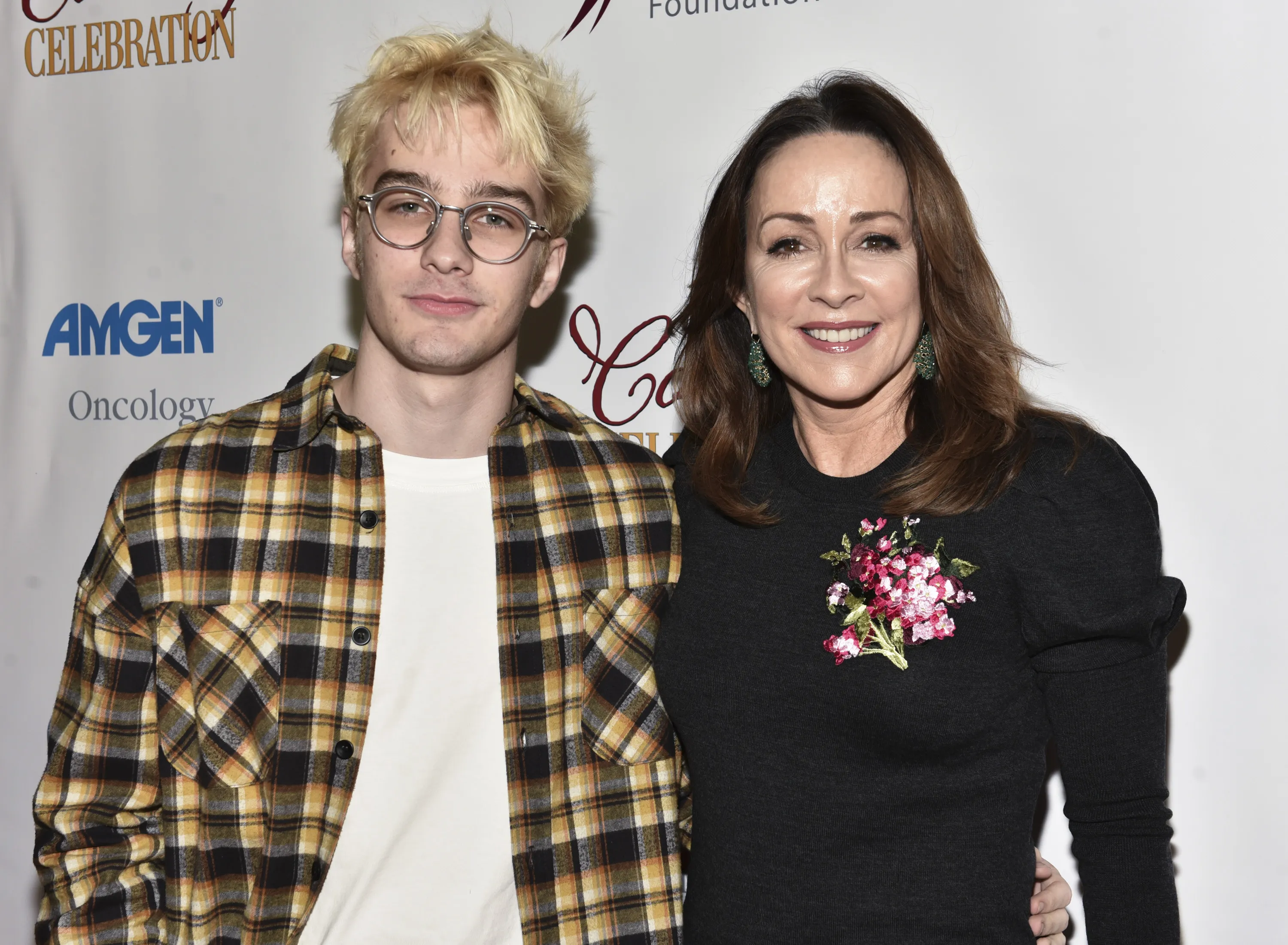 Patricia Heaton and son Daniel Hunt posing on a red carpet.
