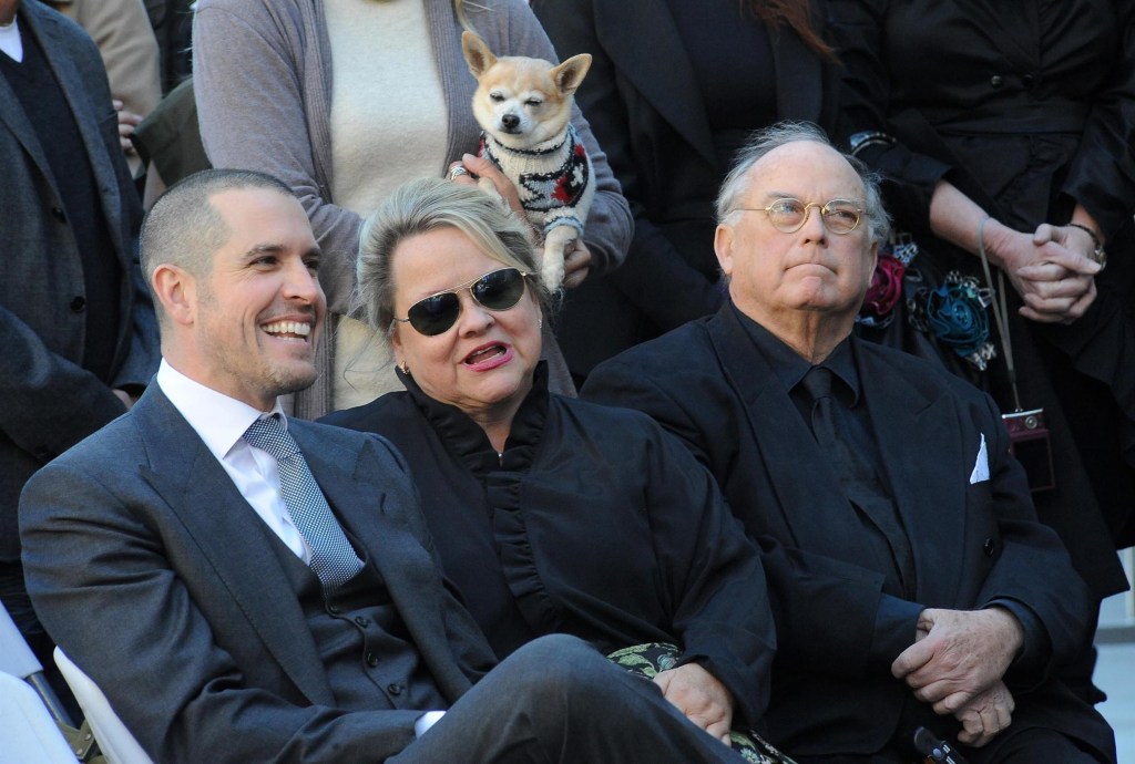 Jim Toth, John Witherspoon, and Betty Witherspoon sitting at Reese Witherspoon's Hollywood Walk of Fame ceremony.