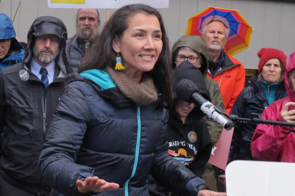 Alaska U.S. Senate candidate Mary Peltola speaking at a campaign rally in the rain.