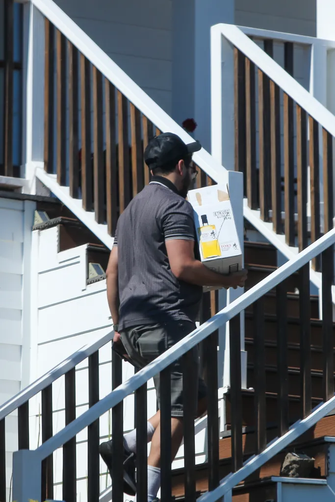 Alberto Carvalho carrying a box labeled