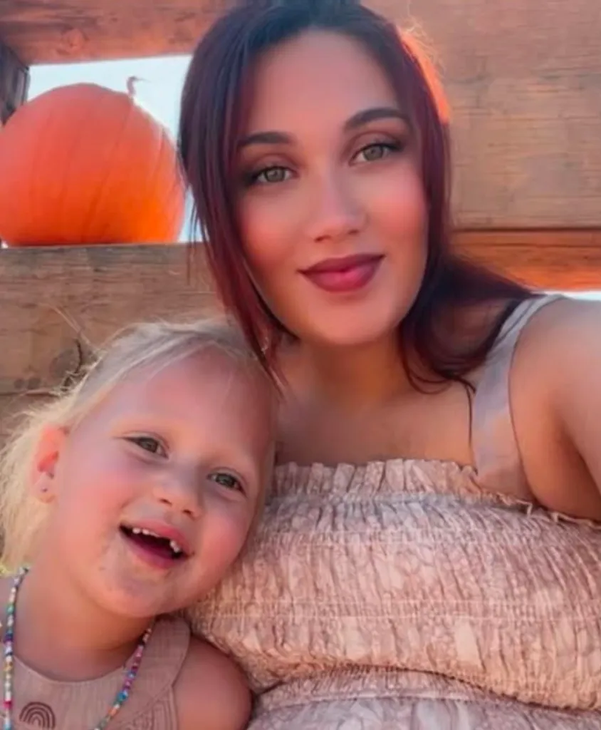 Alison Riley, also known as Tatiana McIntyre, is pictured with a child.