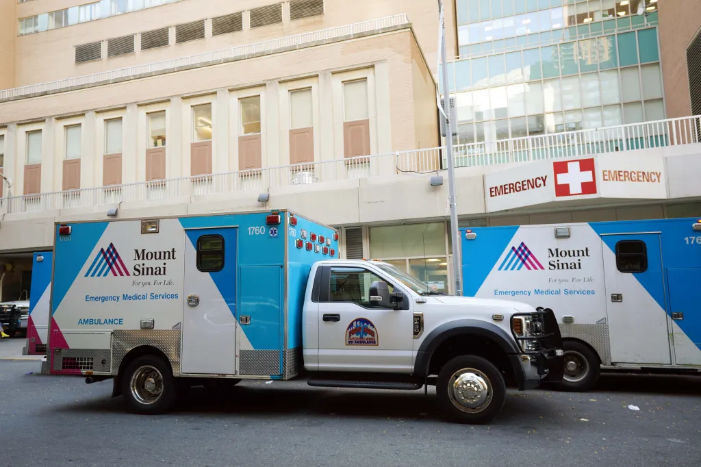 Mount Sinai West Hospital emergency room entrance with two ambulances parked outside.