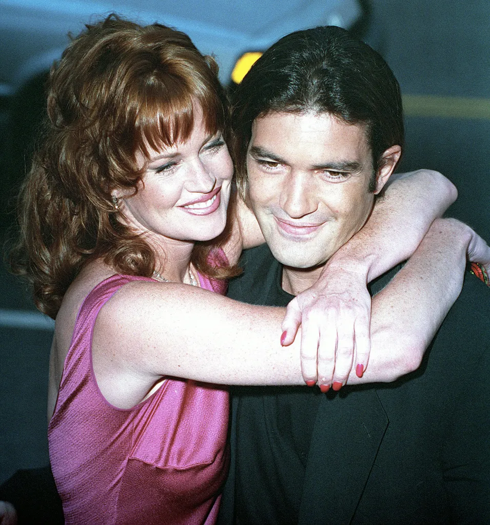 Melanie Griffith and Antonio Banderas smiling and embracing.