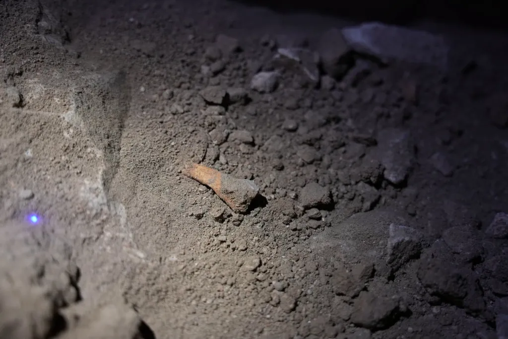 Officers found the burial cave beneath a building — along with other 
