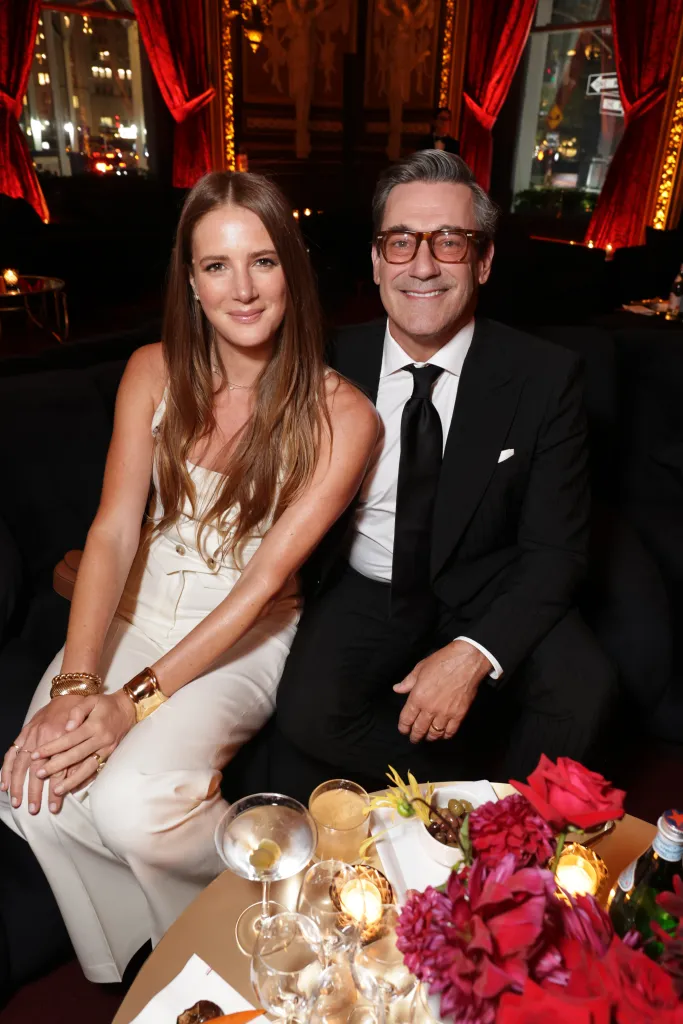 Anna Osceola and Jon Hamm smiling at the premiere of 