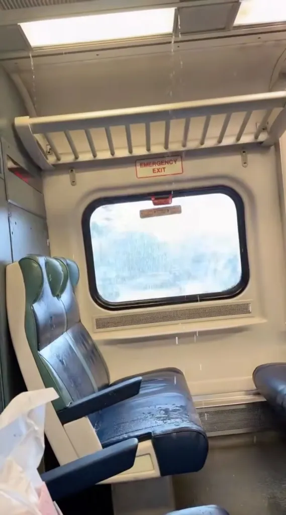 Rainwater pours into a leaking train on Long Island, soaking the seats.
