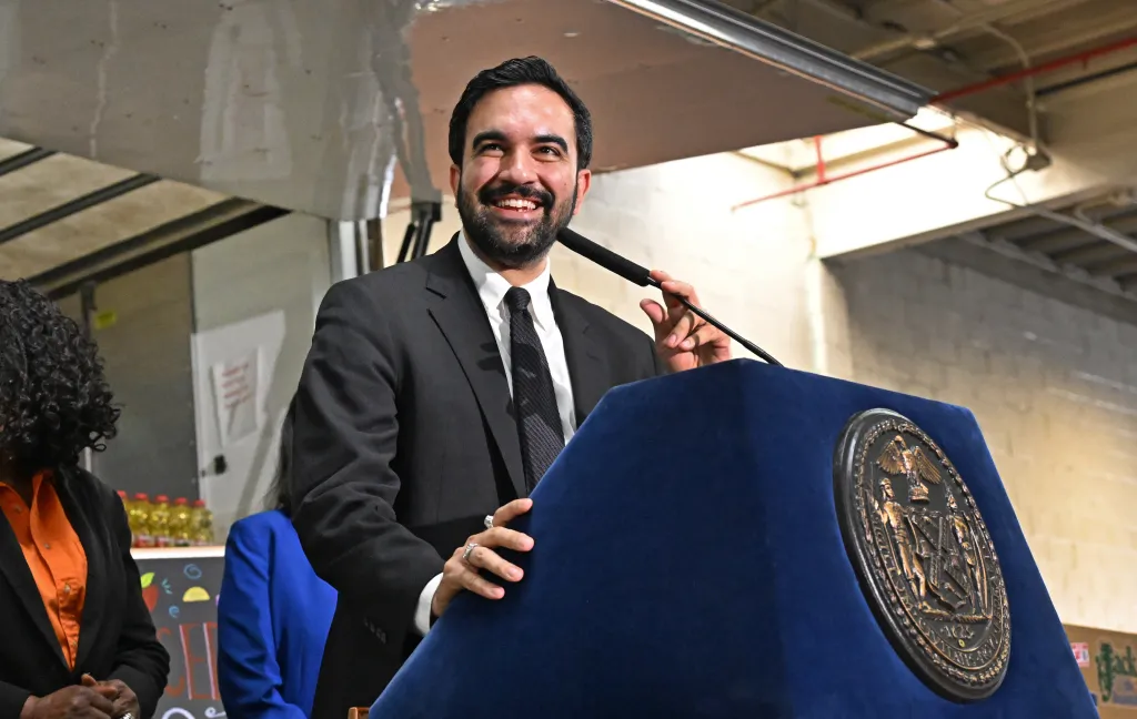 Mayor Mamdani smiling while announcing an RFP for city-run supermarkets.