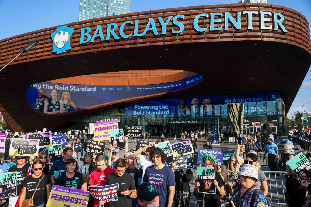 Demonstrators protest anti-trans inclusion outside the Barclays Center.
