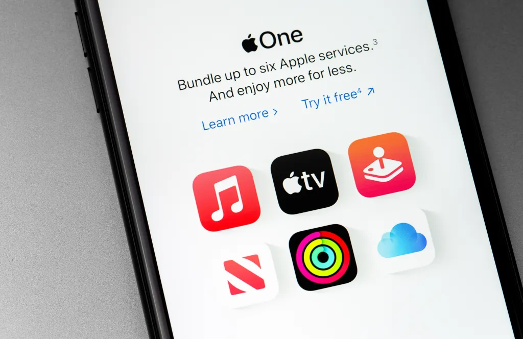 Apple One subscription service displayed on an iPhone screen, showing icons for various Apple services.